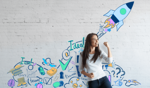 Metro Hr - The power of coaching. Lady standing by graffiti art of rocket