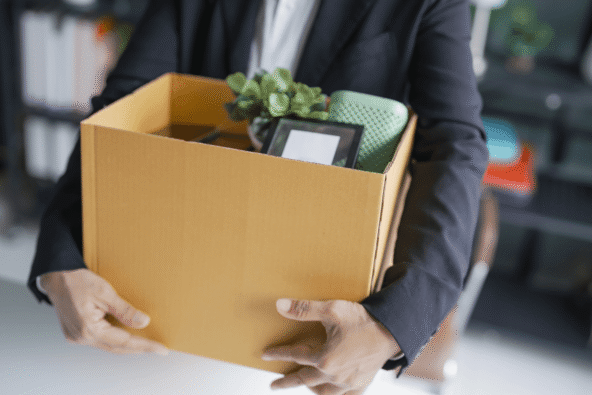 MetroHR_Employment Rights Act 2025 - Unfair Dismissal - Employee holding belongings in cardboard box