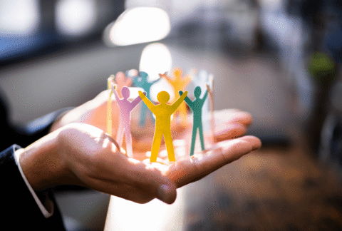 MetroHR_Employment Rights Act 2025 - Person holding paper chain employees gently