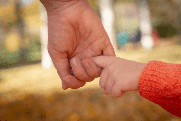MetroHR_Employment Rights Act 2025 - Paternity Leave - Parent holding toddlers finger