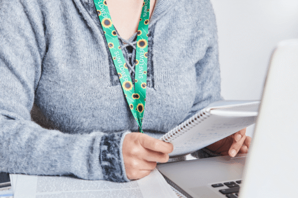 Lady wearing sunflower lanyard - neurodiversity