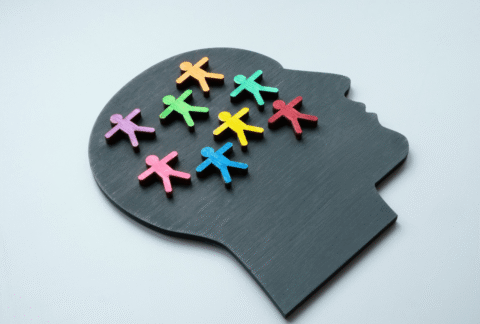 neurodiversity in the workplace - board of head silhouette with colourful wooden people