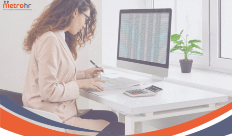 MetroHR Holiday Recording - Lady at desk looking at data on a screen