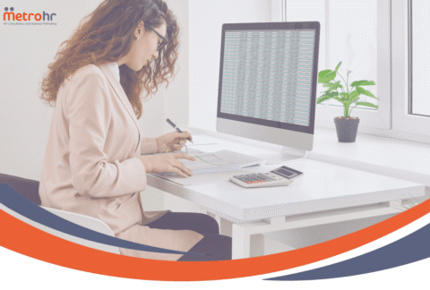 MetroHR Holiday Recording - Lady at desk looking at data on a screen